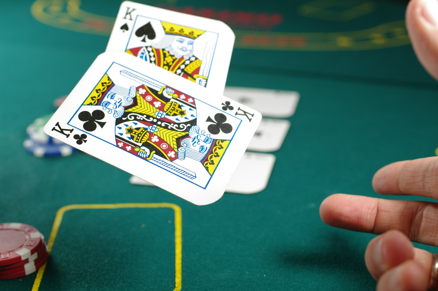 Playing cards above a green casino table